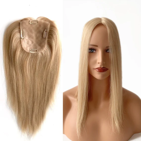 The Natural Straight Blonde Silk Base Human Hair Topper is expertly crafted for women seeking natural-looking volume, flawless scalp realism, and all-day comfort. Made from premium 100% human hair, this topper blends effortlessly with natural hair, delivering a smooth, straight texture and a luminous blonde tone suitable for daily wear or professional styling. The advanced silk base construction creates the illusion of hair growing directly from the scalp, making the parting virtually undetectable even at close range. Unlike traditional lace bases, the silk base conceals knots completely, offering superior realism that meets the expectations of salon professionals and end users alike. Designed with a lightweight and breathable scalp base, this human hair topper provides long-lasting comfort without heat buildup. The secure clip-in system ensures a stable fit while remaining gentle on natural hair, making it ideal for clients experiencing thinning hair, volume loss at the crown, or looking for a non-invasive hair enhancement solution. This straight blonde silk base topper can be washed, heat-styled, toned, or restyled just like natural hair. It is suitable for long-term use and maintains softness, shine, and manageability with proper care. Perfect for resale, salons, wig boutiques, and private-label brands, this product meets international quality expectations for the premium hair market. Key Features 100% premium human hair Natural straight texture with soft blonde finish Silk base for realistic scalp appearance Lightweight, breathable, and comfortable design Secure clip-in attachment system Heat styling and coloring compatible Ideal for thinning crown and top coverage Technical Specifications Specification Item Details Product Type Human Hair Topper Hair Material 100% Human Hair Hair Texture Straight Hair Color Blonde (custom shades available) Base Type Silk Base Base Size Customizable (standard sizes available) Hair Length Options 12–20 inches (custom lengths supported) Density 120% – 150% Attachment Method Pressure-sensitive clips Heat Styling Yes (up to 180°C) Dye & Tone Yes (professional use recommended) Lifespan 12–18 months with proper care Usage Daily wear / professional use Packaging Neutral or private label packaging